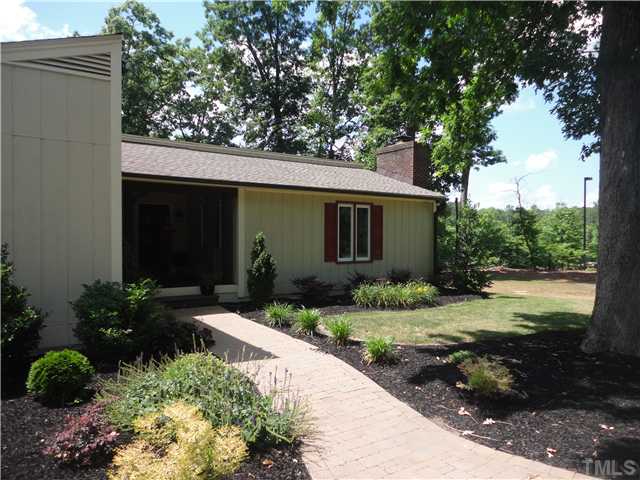 10232 Baileywick Road Raleigh, NC 27613 - Photo 1 of 24 a front view of a house with garden