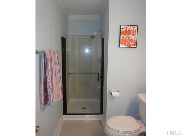 10232 Baileywick Road Raleigh, NC 27613 - Photo 15 of 24 a bathroom with a toilet and a shower