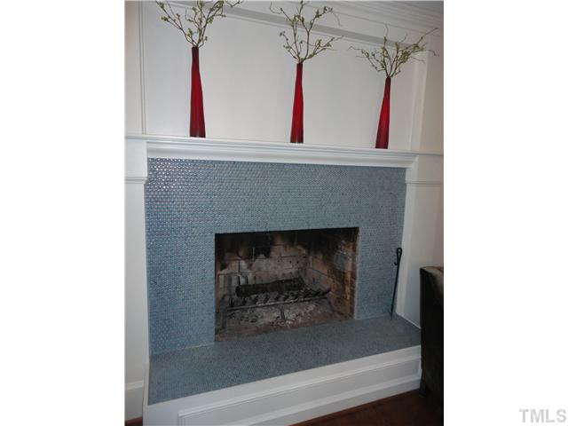 10232 Baileywick Road Raleigh, NC 27613 - Photo 9 of 24 a living room with a fireplace and cabinets