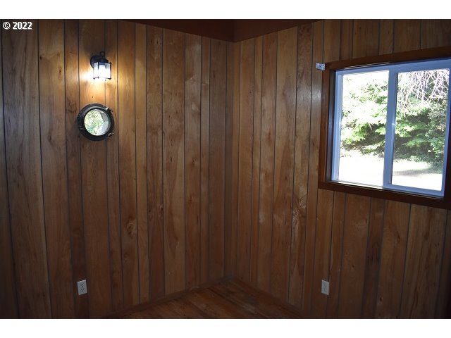 604 Thorton Oar Lane Reedsport, OR 97467 - Photo 20 of 32 a view of empty room with windows