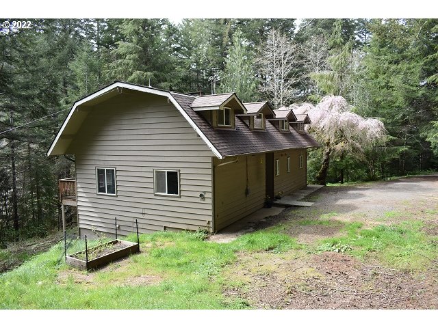 604 Thorton Oar Lane Reedsport, OR 97467 - Photo 2 of 32 a view of a house with a yard