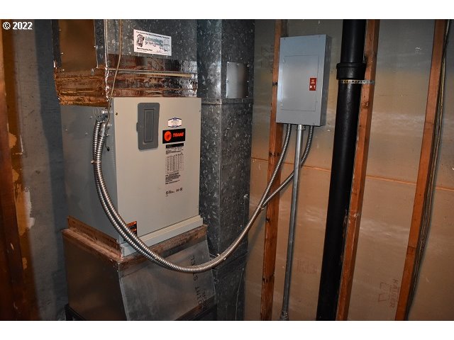 604 Thorton Oar Lane Reedsport, OR 97467 - Photo 32 of 32 a picture of water heater and kitchen