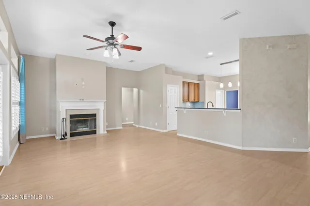 a view of an empty room with a window