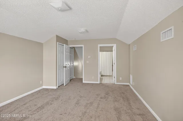 a large bathroom with a double vanity sink and a mirror