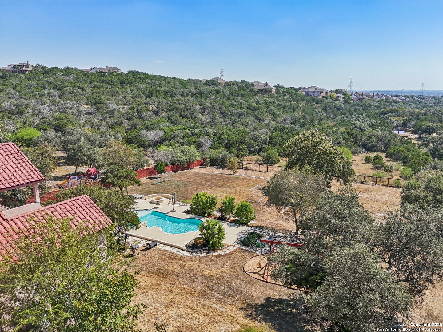 718 Ruidosa Downs Helotes, TX 78023 - Photo 21 of 50 a view of a lake with mountains in the background