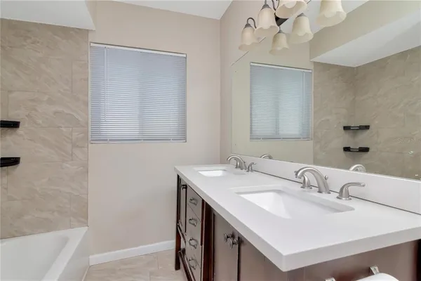 a bathroom with a sink a vanity and a mirror