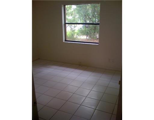 11200 West Sample Road, Unit 1A Coral Springs, FL 33065 - Photo 4 of 9 Master Bedroom