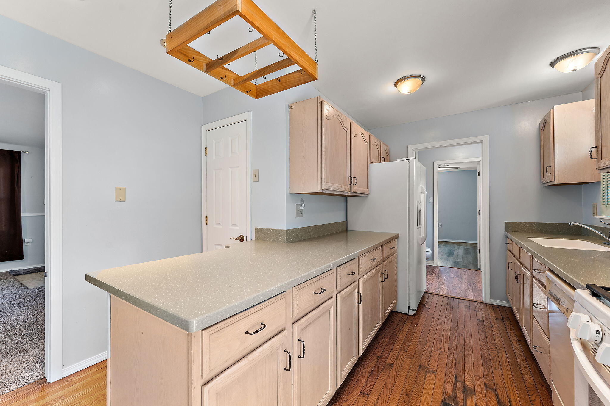 739 Eagle Creek Road Valparaiso, IN 46385 - Photo 10 of 23 a kitchen with a stove a sink and a refrigerator