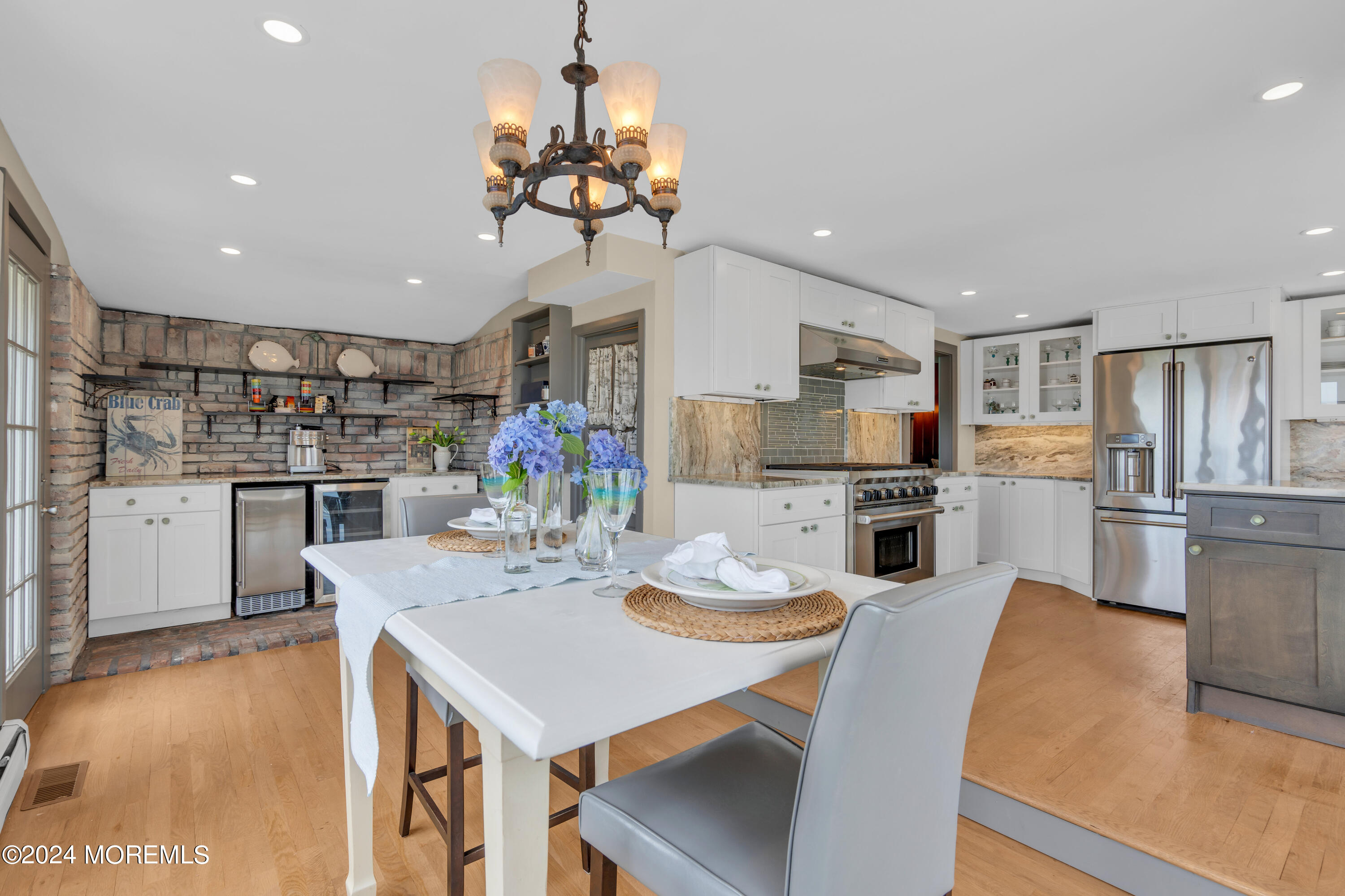 15 Edwards Road Brick, NJ 08723 - Photo 23 of 42 a kitchen with stainless steel appliances kitchen island granite countertop a kitchen island and chairs in it