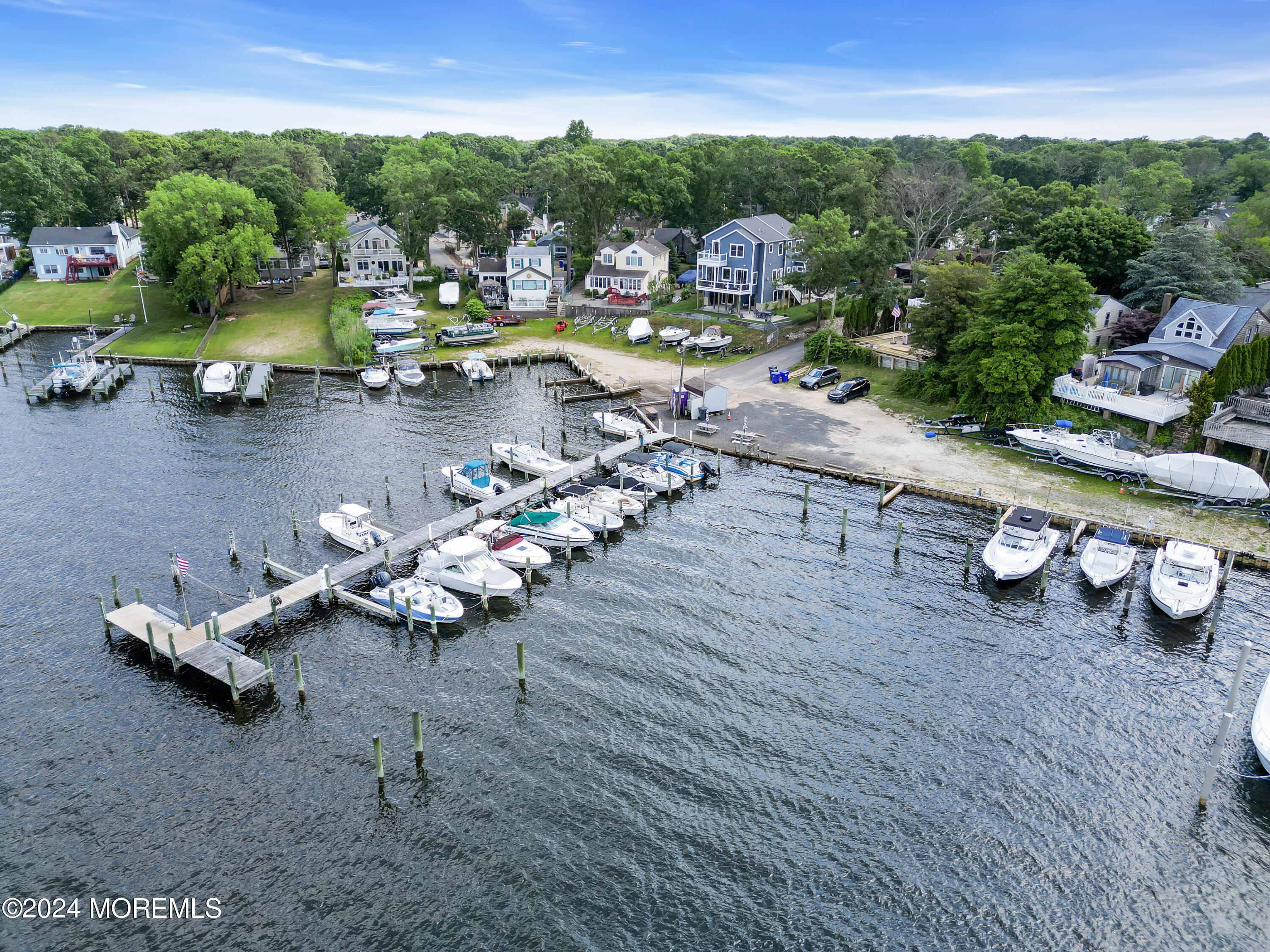 15 Edwards Road Brick, NJ 08723 - Photo 42 of 42 a view of a lake with a table chairs and a fire pit