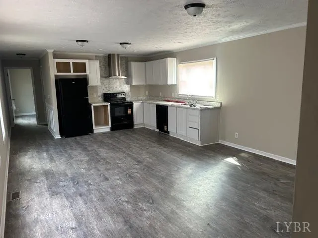 a kitchen with a refrigerator and a sink