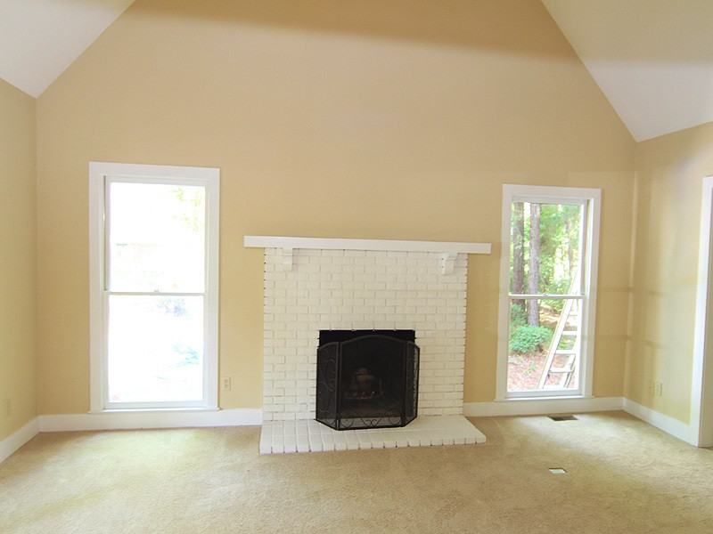 9 Strawberry Ridge Lane Durham, NC 27713 - Photo 3 of 17 Vaulted ceiling and cozy fireplace. All new carpet throughout the house. Living Room