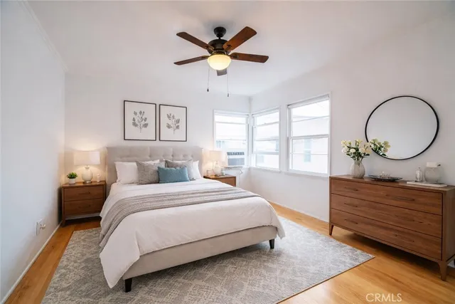 a bedroom with a bed and window