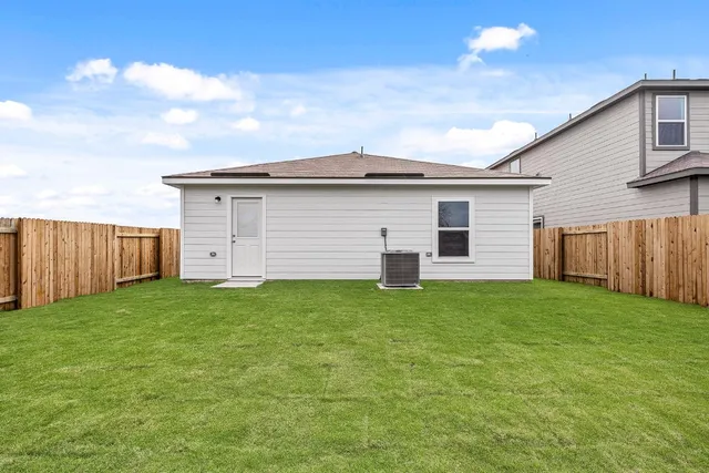 a view of a backyard of the house