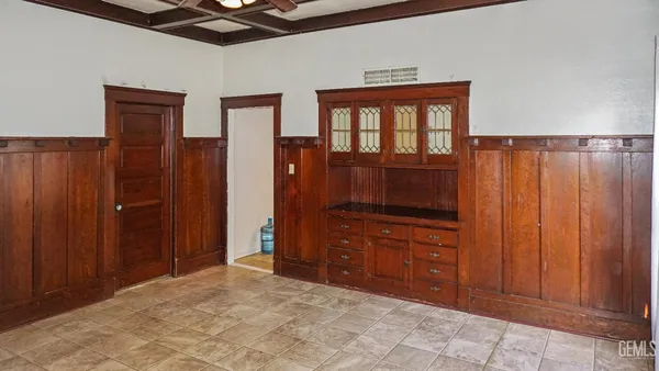 a bedroom with a dresser and a mirror