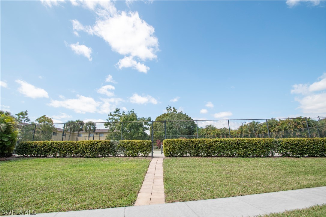 8093 Country Road, Unit 105 Fort Myers, FL 33919 - Photo 19 of 22 a view of a golf course with a big yard