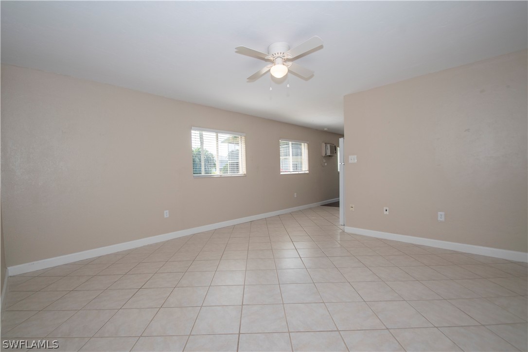 8093 Country Road, Unit 105 Fort Myers, FL 33919 - Photo 3 of 22 a view of an empty room with a window
