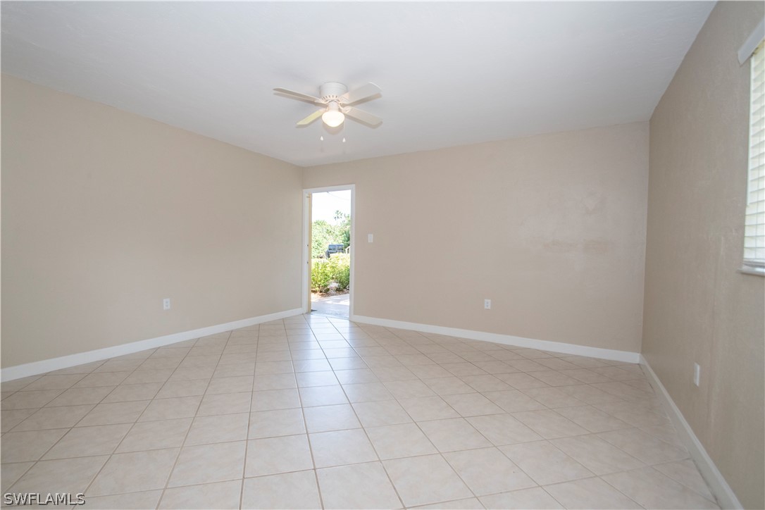 8093 Country Road, Unit 105 Fort Myers, FL 33919 - Photo 5 of 22 an empty room with a empty space and a window