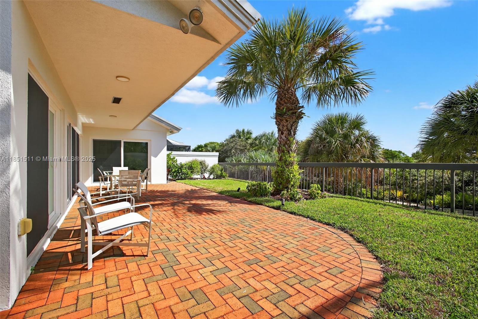 257 Ridge Road Jupiter, FL 33477 - Photo 46 of 84 a view of a house with backyard porch and sitting area