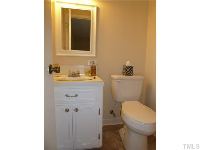 201 Barclay Road Durham, NC 27712 - Photo 18 of 25 Master bathroom has freshly painted vanity, new mirror and light fixutre, new commode and shower with tile surround just to right of commode. New vinyl floor, window onto back yard. Master Bath/Spa