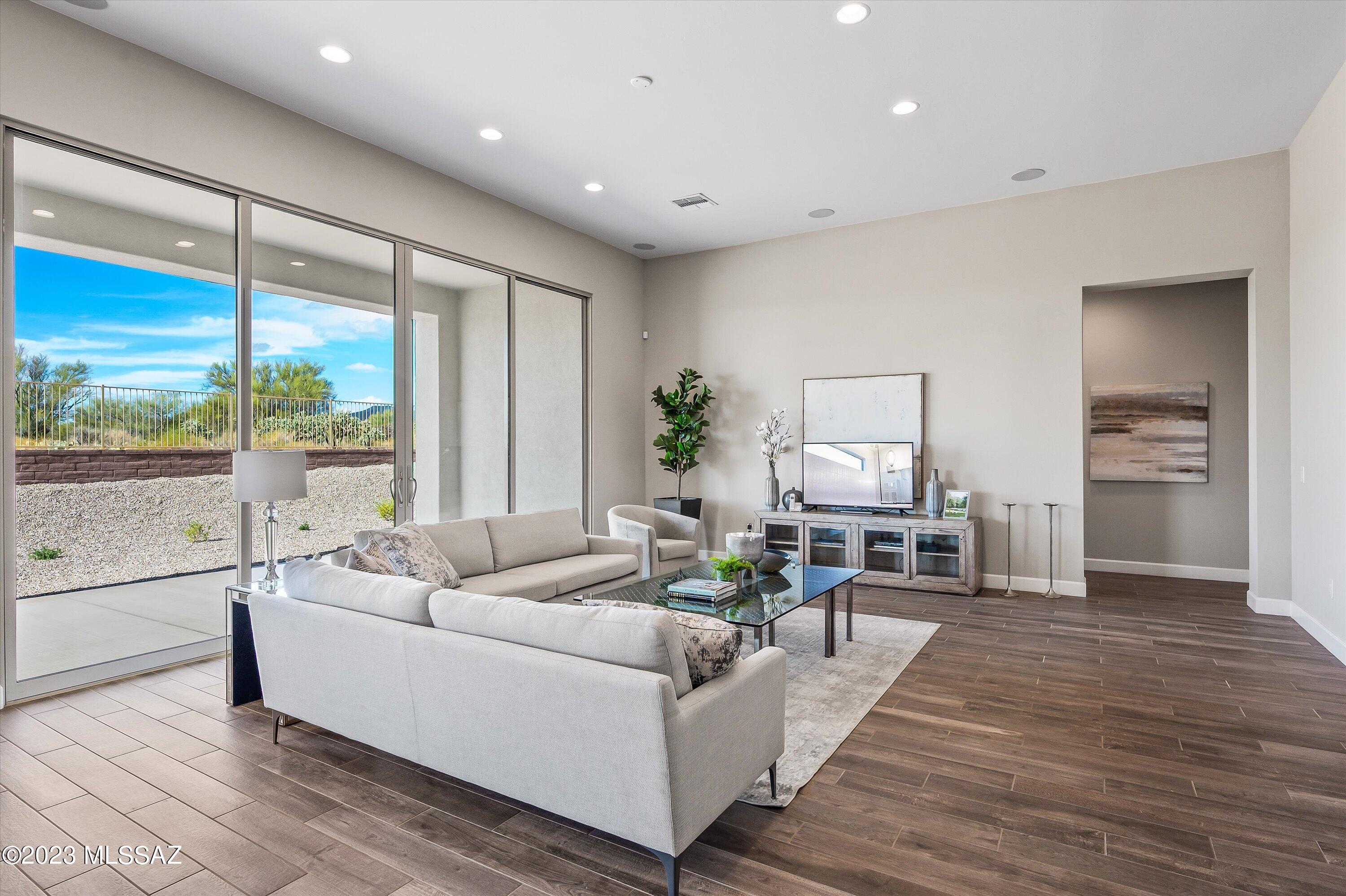13169 North Vistoso Rnch Place Oro Valley, AZ 85755 - Photo 6 of 29 a living room with furniture and large windows