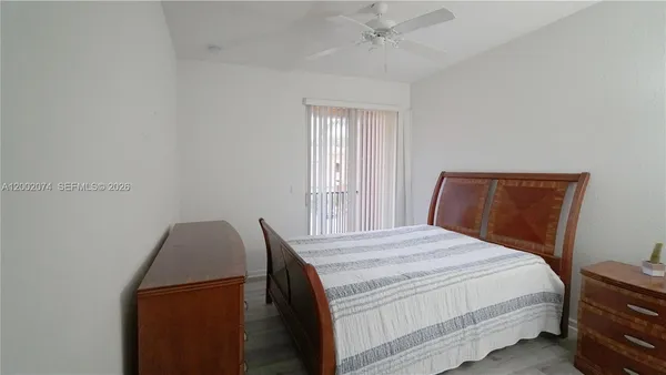 a bedroom with a bed and cabinets