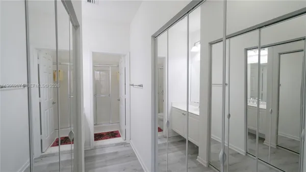 a view of a bathroom with shower