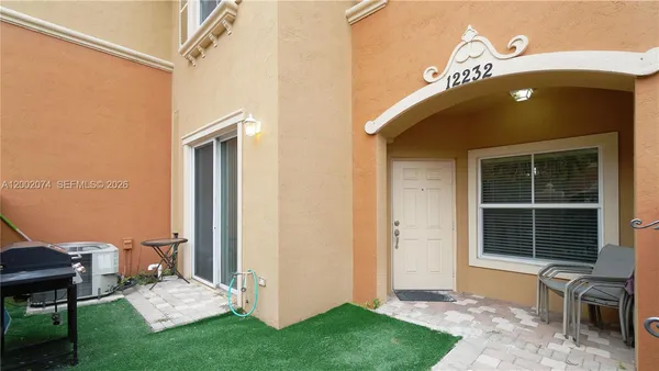 a view of a house with a door and a window