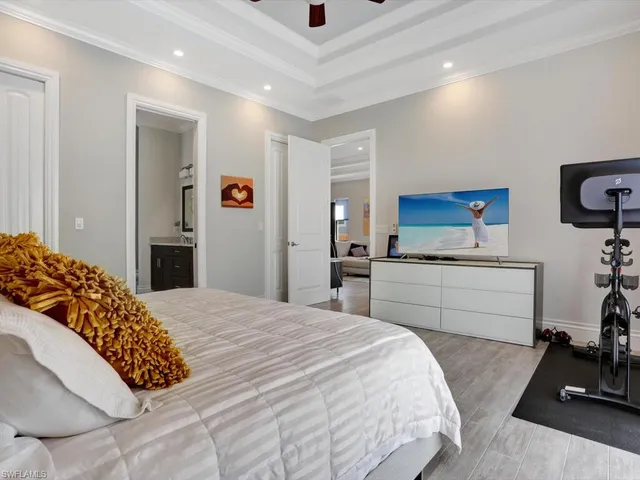 a bedroom with a bed and a dresser