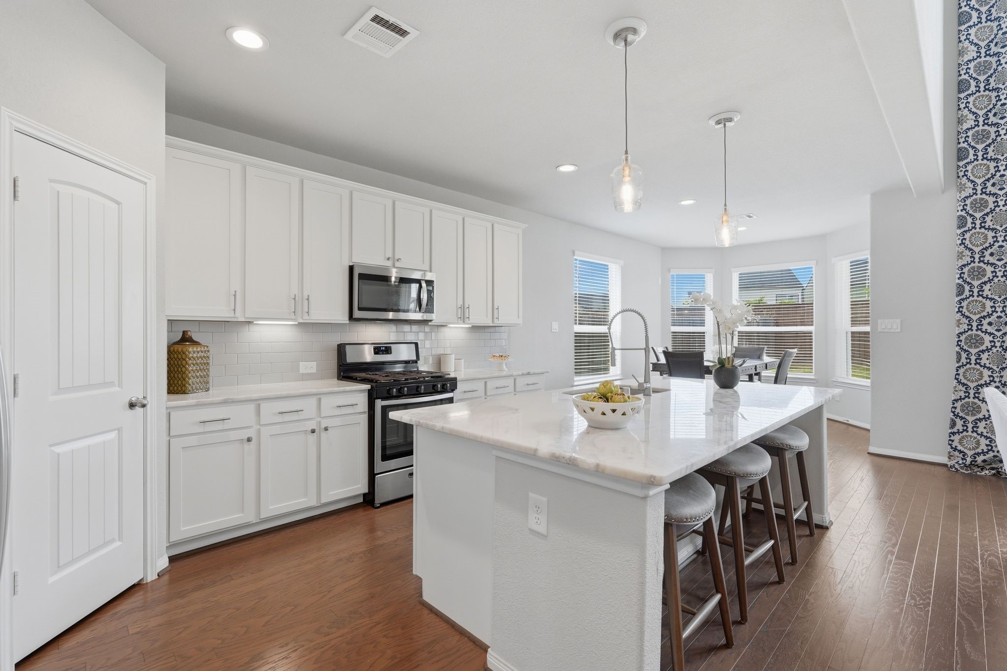 7522 Windsor View Drive Spring, TX 77379 - Photo 17 of 49 Bright kitchen with a large island and plenty of cabinet space.