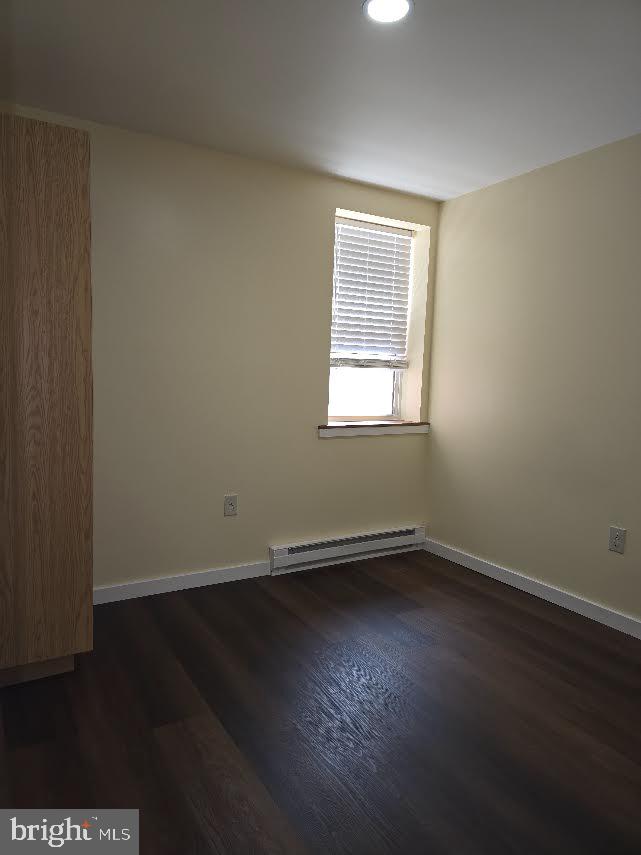 56 Valley Street Lewistown, PA 17044 - Photo 3 of 6 an empty room with wooden floor and windows