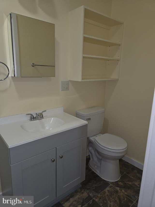 56 Valley Street Lewistown, PA 17044 - Photo 5 of 6 a bathroom with a toilet sink and mirror