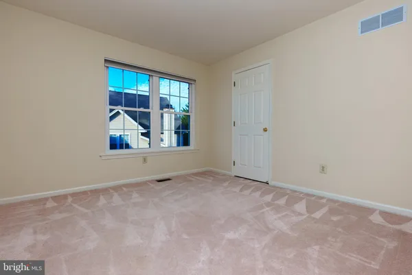 a view of an empty room with window