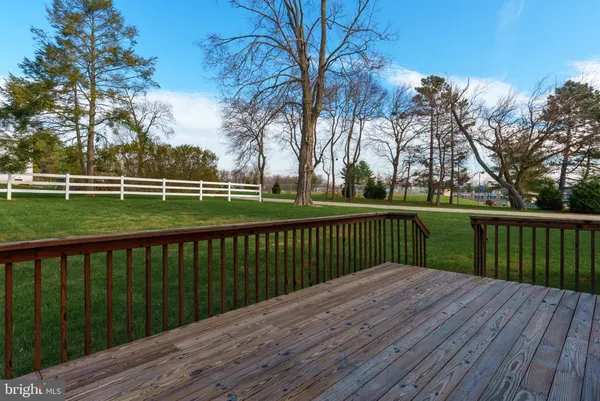 a view of deck with wooden floor and fence