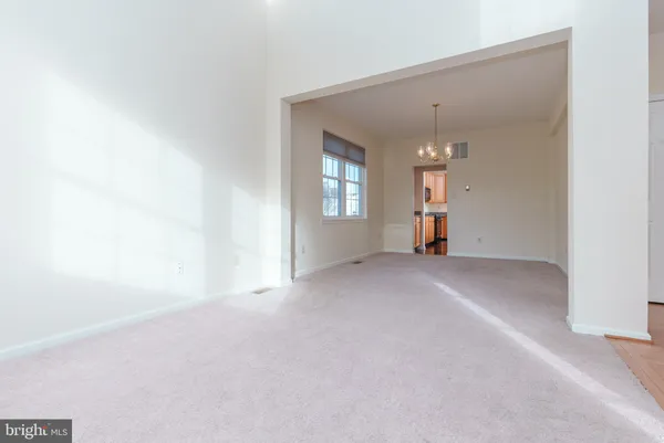 a view of empty room with windows