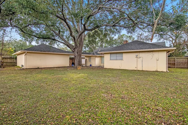 a house that has a tree in front of it
