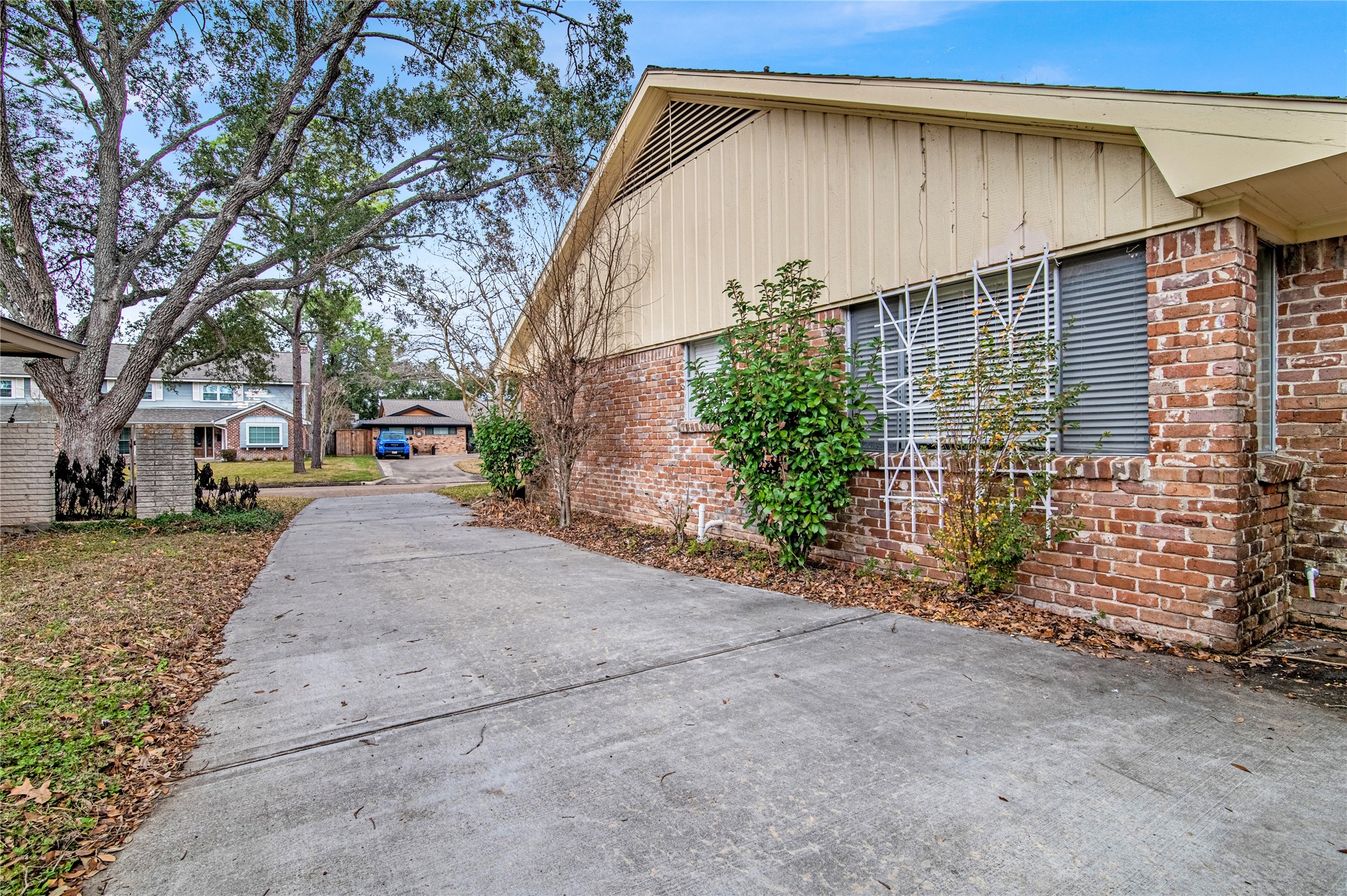 18230 Caprice Lane Houston, TX 77058 - Photo 17 of 34 a view of road with large trees
