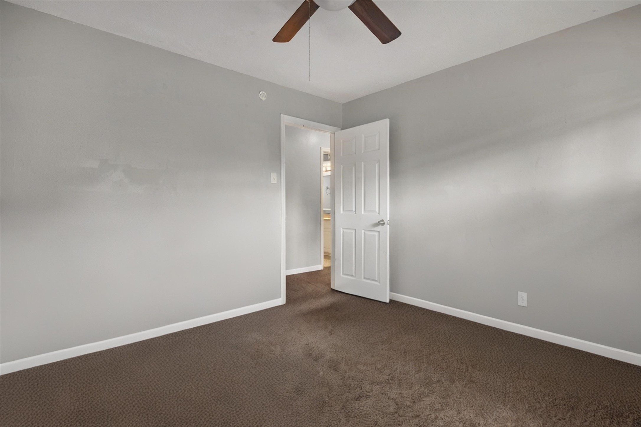 18230 Caprice Lane Houston, TX 77058 - Photo 28 of 34 an empty room with view of a ceiling fan and window