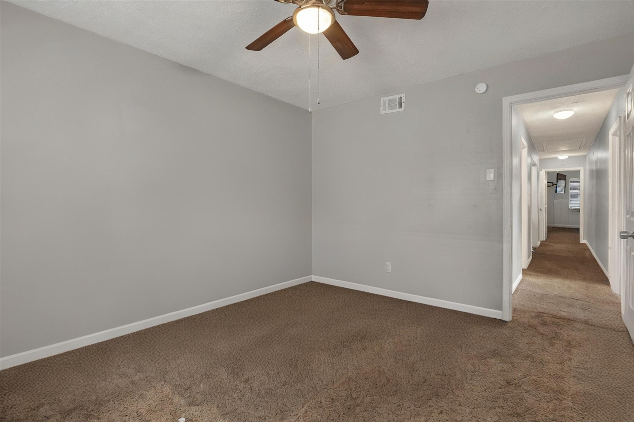 18230 Caprice Lane Houston, TX 77058 - Photo 32 of 34 an empty room with a empty space and chandelier fan