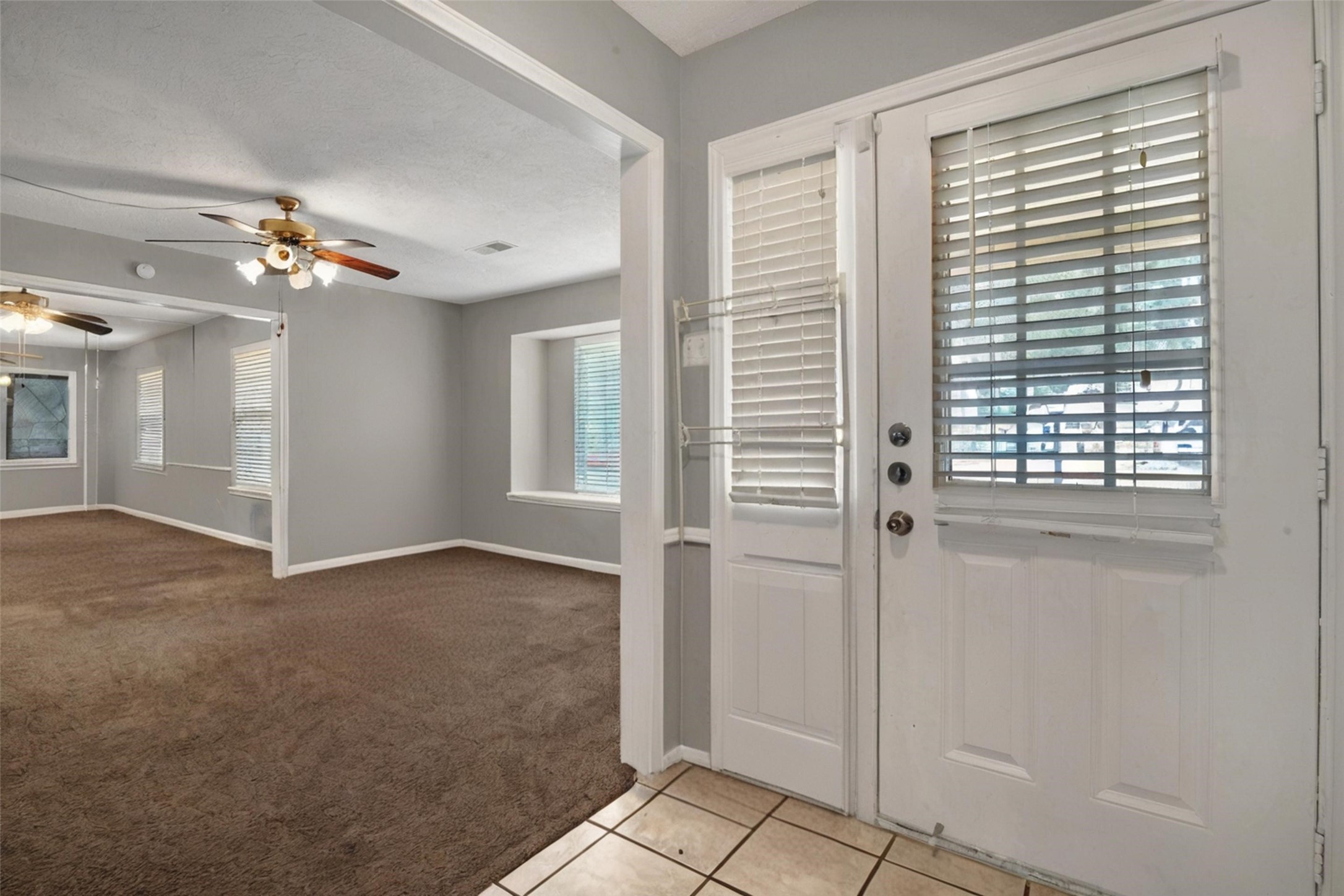 18230 Caprice Lane Houston, TX 77058 - Photo 4 of 34 a view of an empty room with a window
