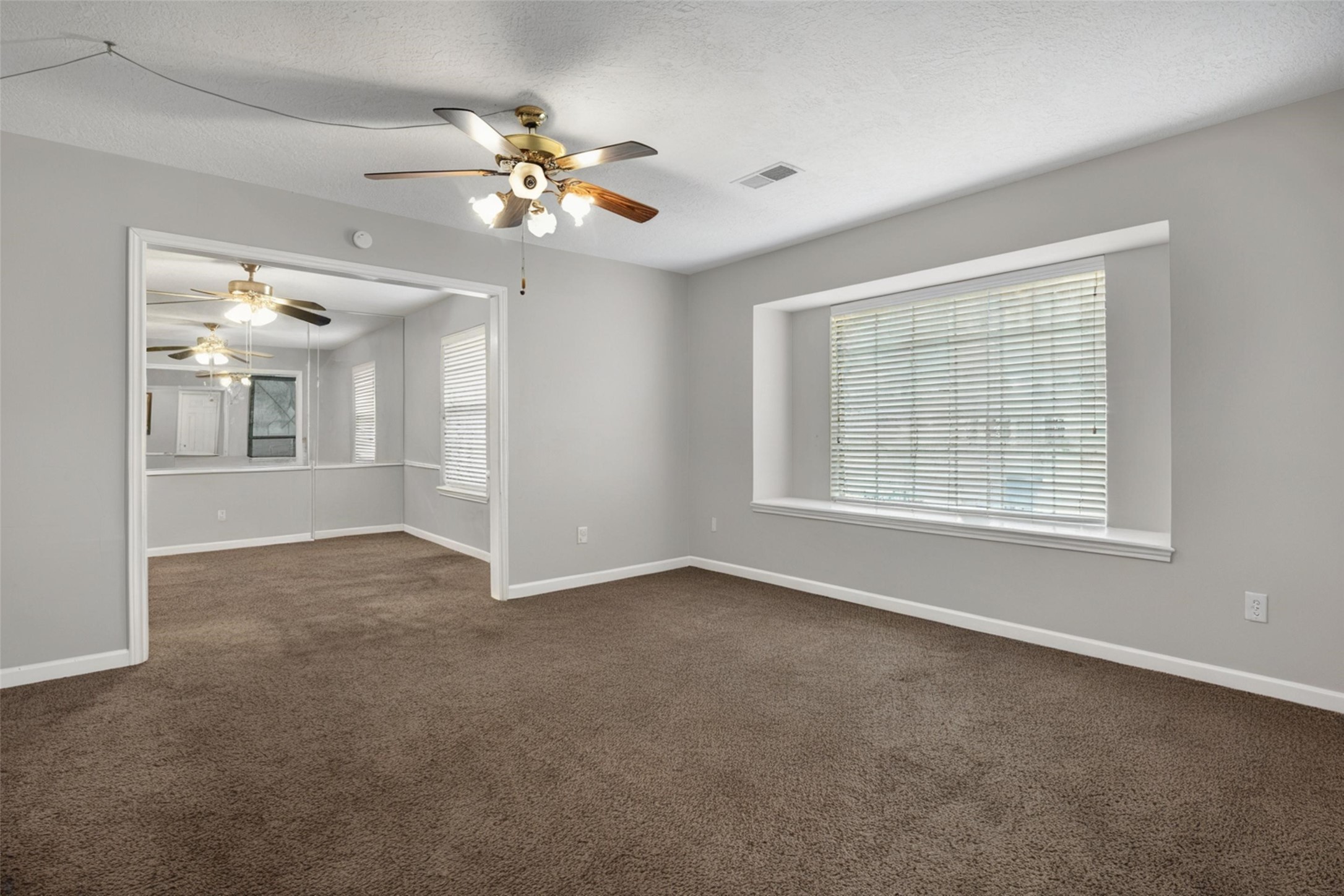 18230 Caprice Lane Houston, TX 77058 - Photo 5 of 34 a view of an empty room with a window