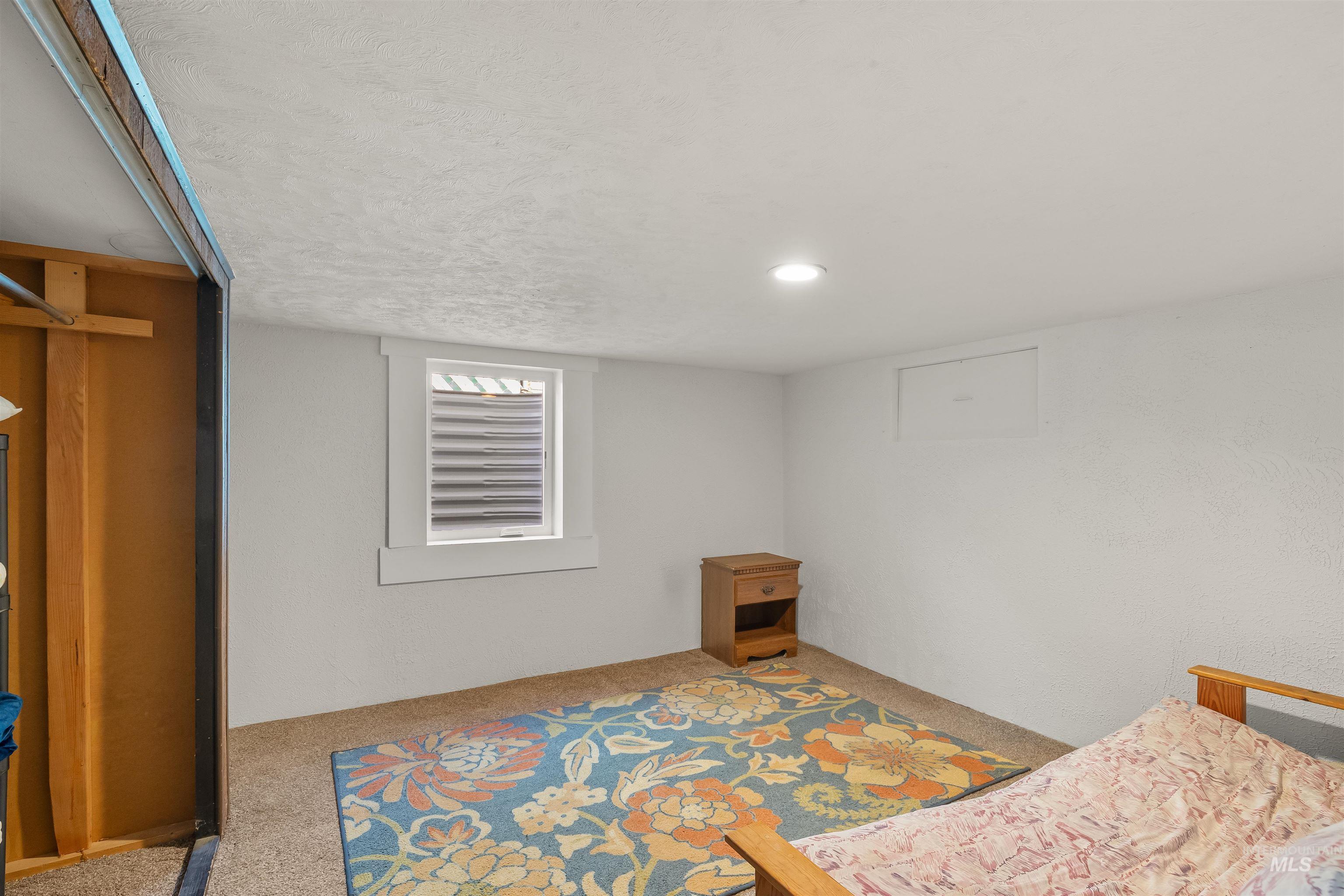 924 N Street Lewiston, ID 83501 - Photo 35 of 46 Carpeted room featuring a white-trimmed window, recessed lighting, and white painted walls