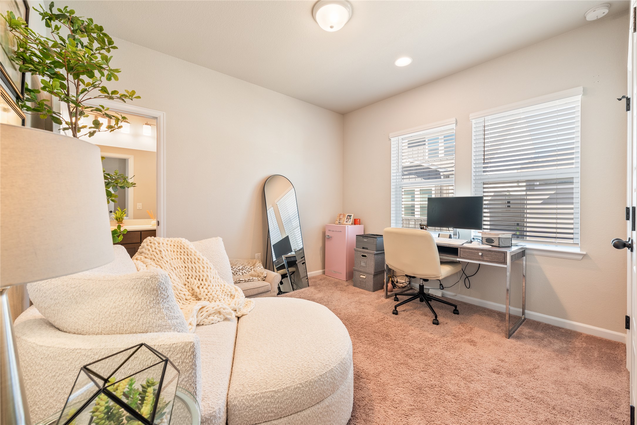 13602 Terrett Trace, Unit 102 Austin, TX 78717 - Photo 12 of 23 a view of a workspace with furniture and a window