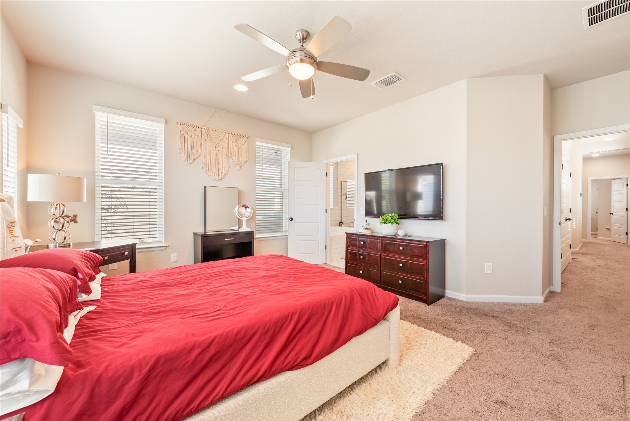 13602 Terrett Trace, Unit 102 Austin, TX 78717 - Photo 16 of 23 a bedroom with a bed and a flat screen tv