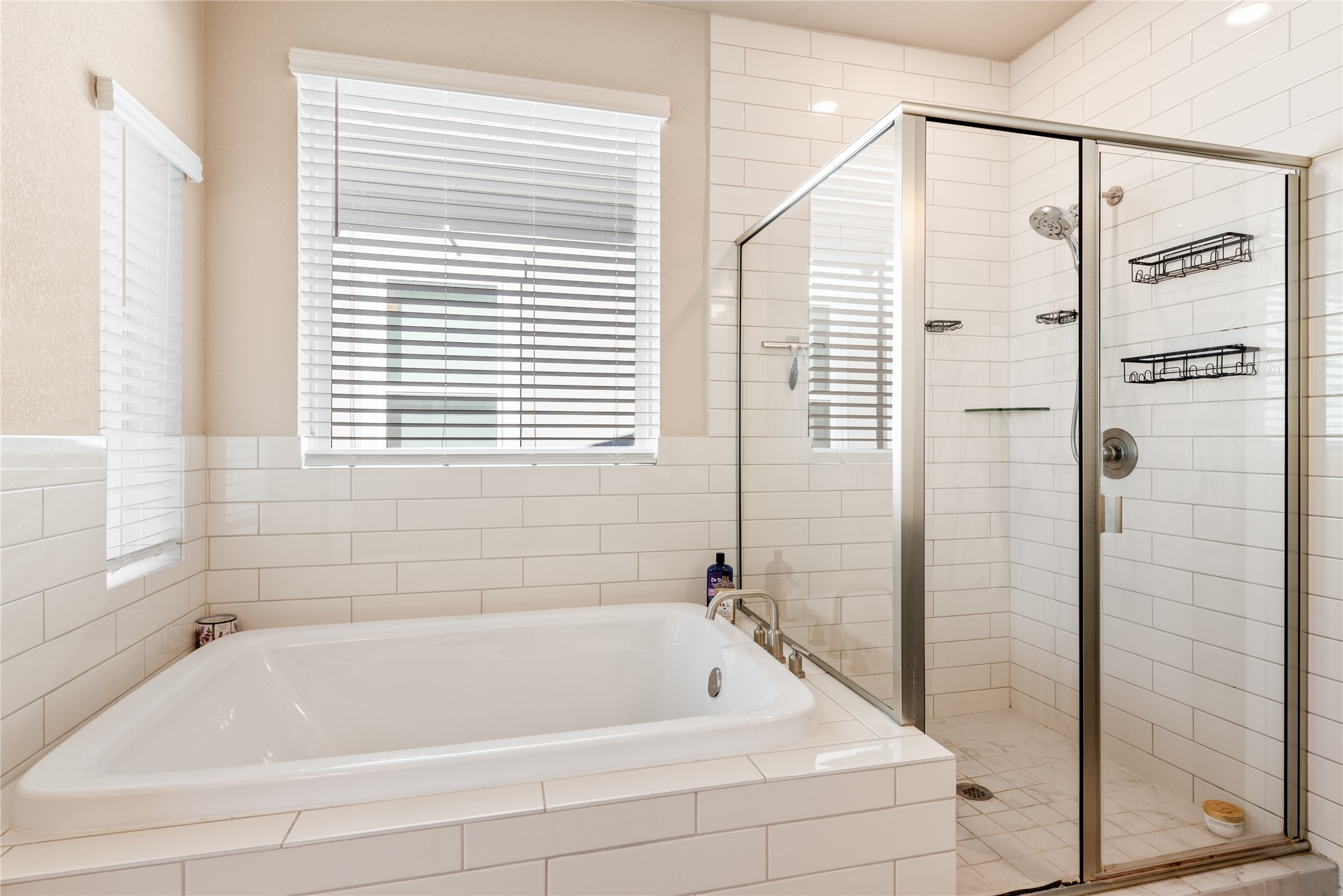 13602 Terrett Trace, Unit 102 Austin, TX 78717 - Photo 18 of 23 a bathroom with a bathtub and a shower