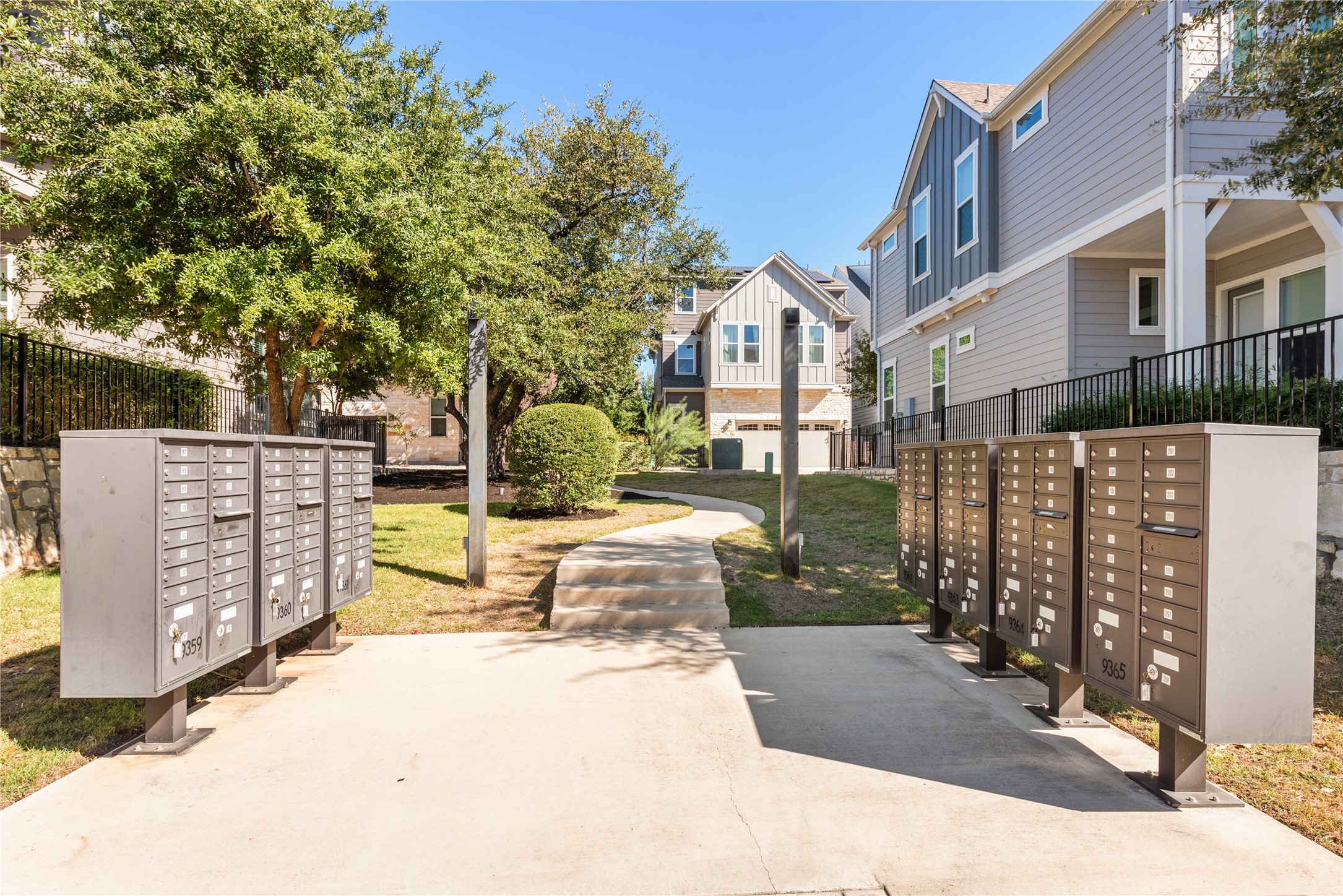 13602 Terrett Trace, Unit 102 Austin, TX 78717 - Photo 22 of 23 a view of a brick house with many windows