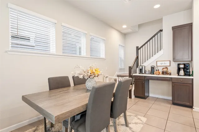 a dining room with furniture and window
