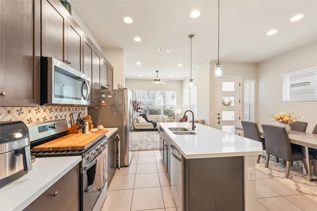 a kitchen with counter top space appliances and a sink