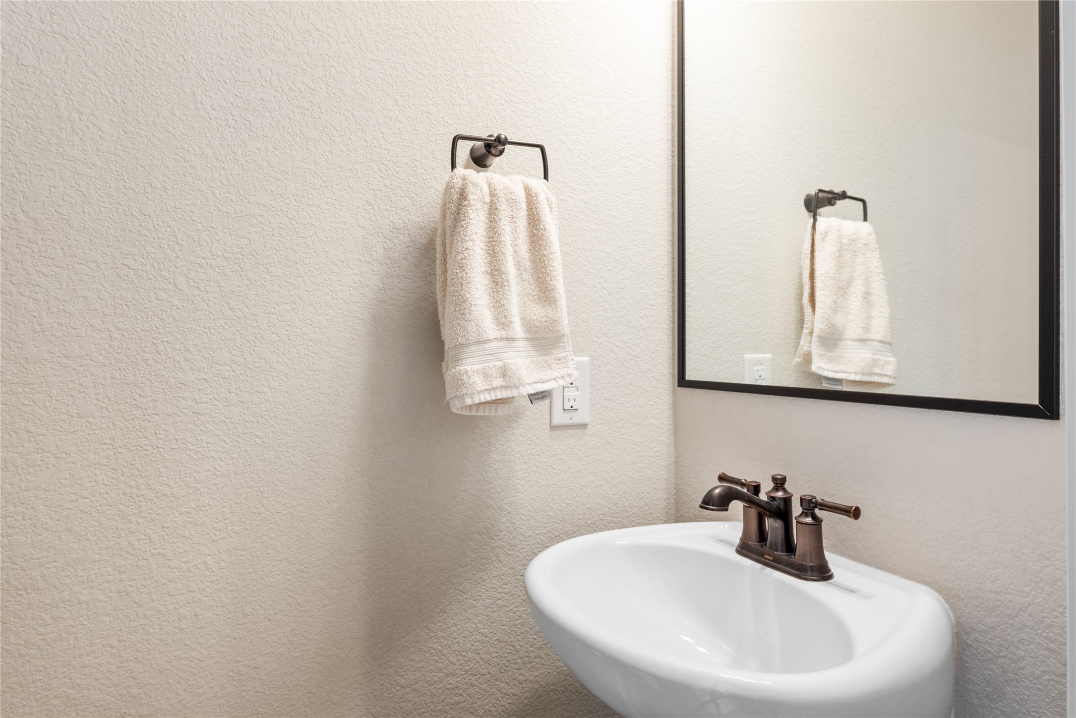13602 Terrett Trace, Unit 102 Austin, TX 78717 - Photo 9 of 23 a bathroom with a sink and mirror