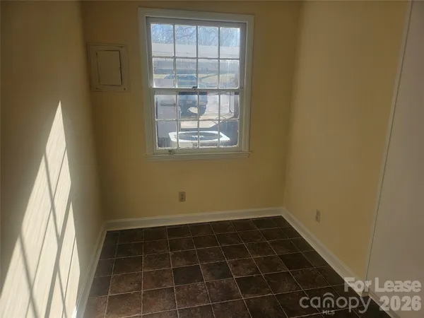 a kitchen with granite countertop a sink stove and refrigerator